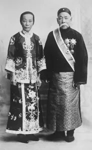 Investiture by Prince George. Sir Shou son Chow, who was recently invested by