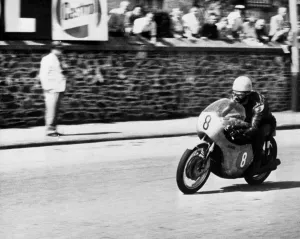 Isle of Man: Jim Redman pictured at speed on his new four-cylinder Honda during
