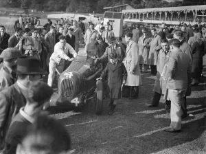 Racecar Prints: J H T Smiths M G is man handled through the crowd. 1938