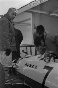 World Champion Prints: Japanese mechanics working on the suspension of John Surtees Honda car during testing