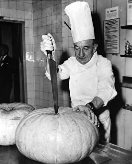 Cheers! vintage food and drink Collection: Jean Boutheney, a French chef born in Newcastle-upon-Tyne, chops a large pumpkin