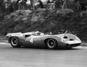 Motor Cycling Prints: John Surtees No 4, driving a Lola 70 Chevrolet. He won both heats of the Guards