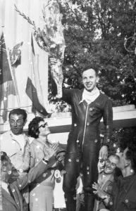 Driver Prints: John Surtees acknowledges the cheers of the crowd after his second victory at Monza Italy