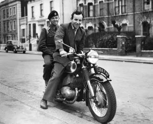 John Surtees, international motor cyclist from Forest Hill, London, was approached