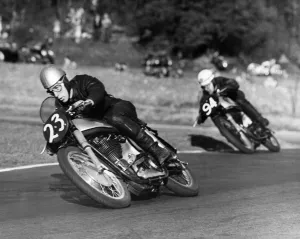 Cornering Prints: John Surtees Here pictured crouching around a corner on his way to win at Brands