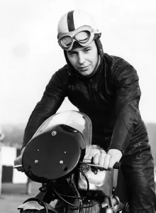 John Surtees practising at Brands Hatch on his Norton motorbike. He is trying to