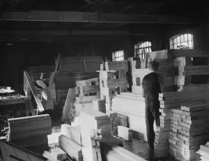 Timber Prints: A joiner works on a piece at the G Ellis joinery works in Hackney. 7 April 1938