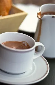 Pretty Prints: Jug and cup of hot drinking chocolate, on French cafe table credit: Marie-Louise