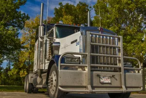 Truck Prints: Kenworth 6x4 semi unit parked in the sun against gorgous autumn colours, taken