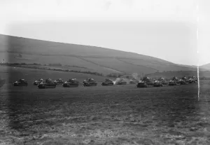 Army Prints: King Amanullah watches mimic tank battle at Lulworth Dorset. Tanks shelling