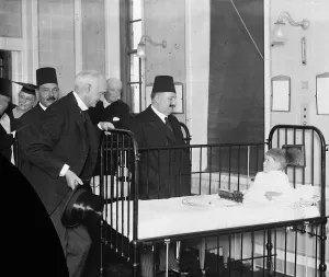 Royal Visit Prints: King Fuad at the Royal Free Hospital. King Fuad chatting with Jack Baker, aged