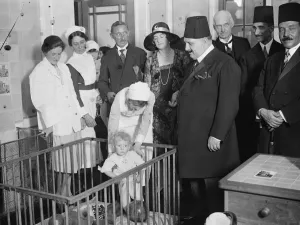 King Fuad at the Royal Free Hospital. A little patient who presented King Fuad with his doll