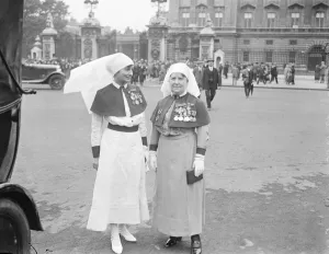 King holds investiture at Buckingham Palace. Matron in Chief Florence Hodgins