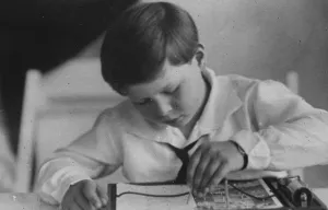 A King at play. King Michael of Rumania with one of his Christmas toys. 5 January