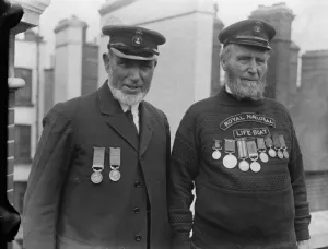 The King receives lifeboat VC s. In connection with the Lifeboat Centenary celebrations