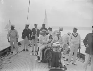 The King takes the wheel of his yacht Britannia. Waiting for the starting signal