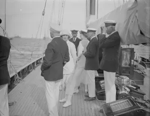 The King takes the wheel of his yacht Britannia. 7 August 1924