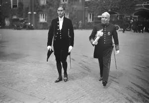 Kings levee at St Jamess Palace. Sir William Bull and his son, Mrs Bull leaving