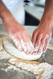 Inspiration Collection: Kneading pizza dough on stainless steel surface. credit: Marie-Louise Avery / thePictureKitchen