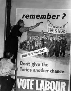 One of the Labour posters for the General Election campaign being put up at Transport House