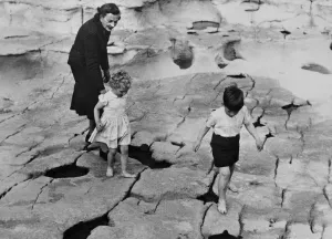 Beach Prints: Lady Mountbatten keeps an eye on Prince Charles and Princess Anne who enjoys some