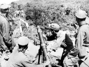 Laos: Royal Laotian soldiers ready for action with an 81mm mortar from a position