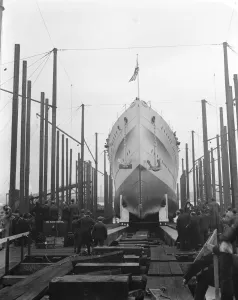 The launch of HMS Kent. HMS Kent, one of the county class cruisers, was launched