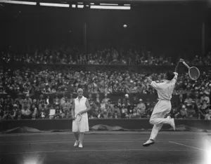 Lawn tennis at Wimbledon. H Austin and Betty Nuthall in play. 27 June 1929
