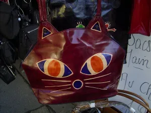 Design Prints: Leather bag decorated with motif of a cats face, market stall, Dieppe, Seine-Maritime