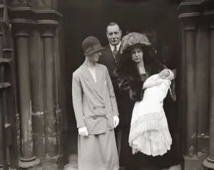 Lieutenant General Sir Travers Clarke and Lady Clarke ( with baby ) at the Christening