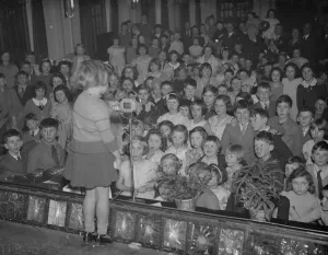 Microphone Prints: A little girl entertains the audience of children at the childrens party