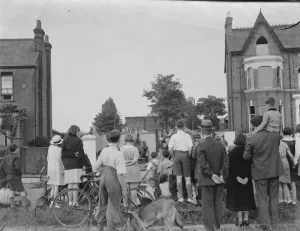 Locals gather at the site of the timber yard fire in Bexleyheath, Kent
