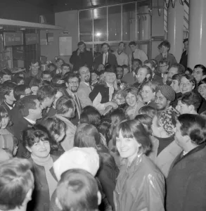 London : Fans surround folk singers Peter ( with glasses ), Paul and Mary as they