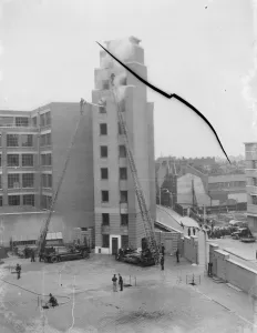 A London Fire Brigade display in Lambeth, London. Firemen use extension ladders to gain access