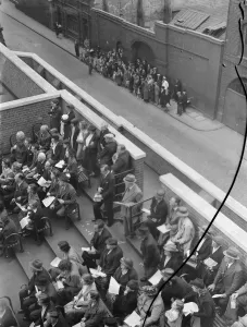 A London Fire Brigade display in Lambeth, London. The crowd watches firemen tackle