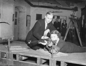 London office girls become expert with the rifle. Girls employed in the offices