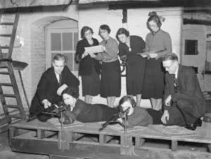 London office girls become expert with the rifle. Girls employed in the offices