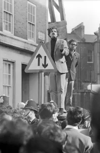 London: Pakistani-born student leader Tariq Ali stands a top pillar-box near