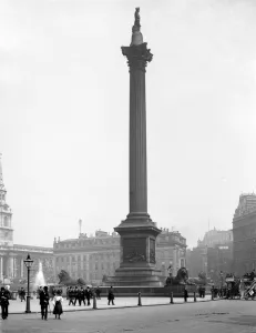 20 Century Prints: London street scene Nelsons Column in Trafalgar Square, London, England with Morley