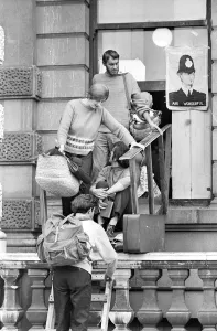 London: A women and child is assisted by squatters to enter the empty 60 room mansion a 144