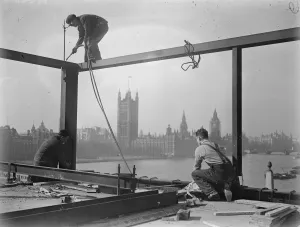 London Prints: He looks down on Parliament. A welder on a precarious perch high above the Albert Embankment