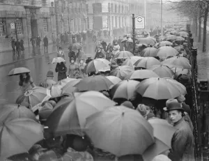 The Lying in State of King George V at Westminster Umbrellas in the queue, that