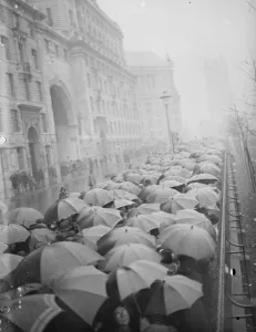 The Lying in State of King George V at Westminster Umbrellas in the queue, that