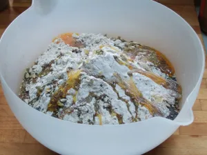 Making bread. Bowl with ingredients ready to mix. Wholemeal multigrain flour, pumpkin