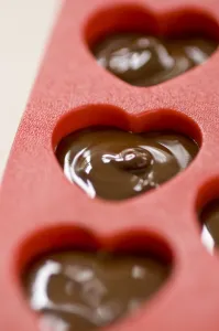Making Prints: Making heart shaped in chocolates for Valentines day in red heart shaped mould credit