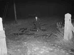 Night Prints: A man walking down Church Road in Kingsdown, Kent. 12 December 1938