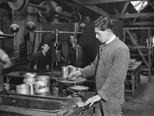 Manufacture of cork balls at Chingford Weighing the compound before moulding 28