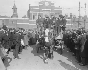 March of ex - soldiers from Woolwich Arsenal to see the Premier. Wounded men leaving