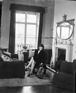 Home Prints: Margot Fonteyn at home. Chee, Miss Fonteyns Siamese cat, looks blissfully happy