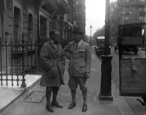 Actor Prints: Mary Pickfords former husband in London. Mr Owen Moore ( wearing hat ) talks to a friend